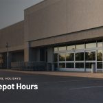 Big-box hardware store entrance at sunrise with shopping carts lined up outside
